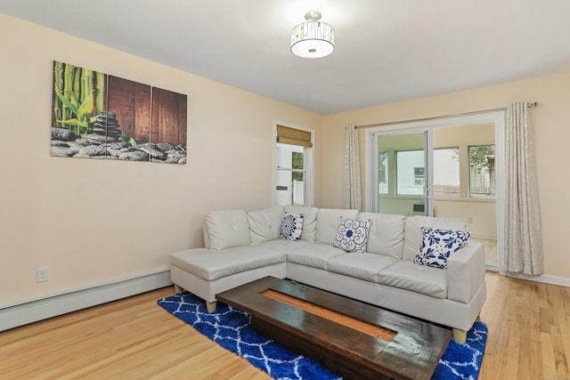 11 Park Ln, Trumbull, CT 06611 - living room with wood finished floors, healthy amount of natural light, and a baseboard heating unit