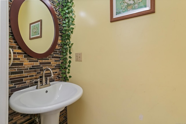 11 Park Ln, Trumbull, CT 06611 - bathroom featuring a sink and decorative backsplash