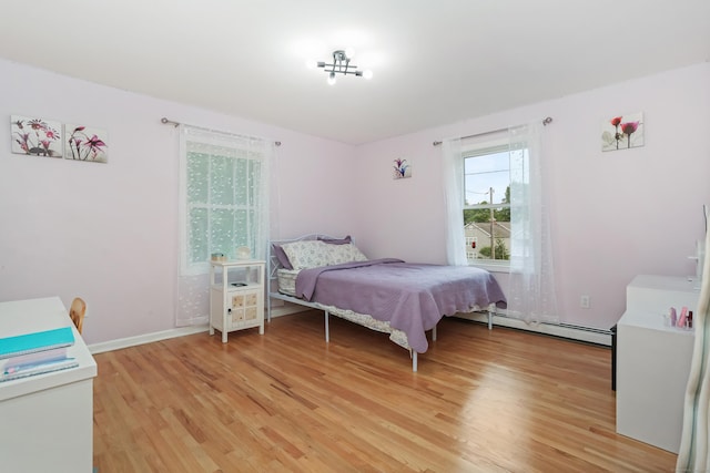 11 Park Ln, Trumbull, CT 06611 - bedroom featuring a baseboard radiator and light wood finished floors