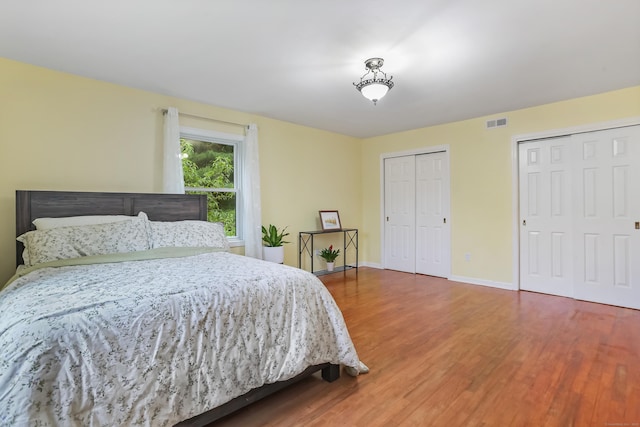 11 Park Ln, Trumbull, CT 06611 - bedroom with multiple closets and wood finished floors