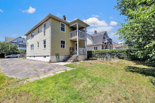 70 Sage Ave, Bridgeport, CT 06610 - back of house featuring a balcony and a chimney