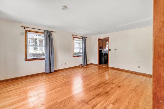 70 Sage Ave, Bridgeport, CT 06610 - empty room featuring healthy amount of natural light, light wood-type flooring, and a smoke detector