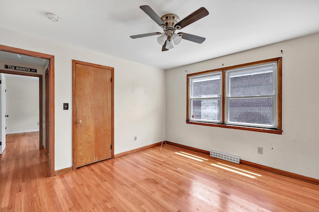 70 Sage Ave, Bridgeport, CT 06610 - unfurnished bedroom with light wood-style floors and a ceiling fan