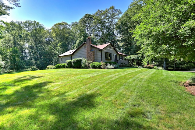 23 Fox Rd, Trumbull, CT 06611 - view of property exterior with a chimney and a lawn