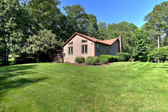 23 Fox Rd, Trumbull, CT 06611 - view of property exterior featuring a chimney and a lawn