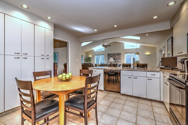 23 Fox Rd, Trumbull, CT 06611 - kitchen featuring range with electric cooktop, a peninsula, lofted ceiling, ceiling fan, and white cabinets