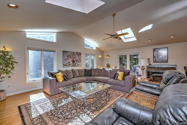 23 Fox Rd, Trumbull, CT 06611 - living area with a skylight, light wood-style floors, vaulted ceiling, and ceiling fan