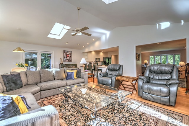 23 Fox Rd, Trumbull, CT 06611 - living room with a skylight, lofted ceiling, ceiling fan, and wood finished floors