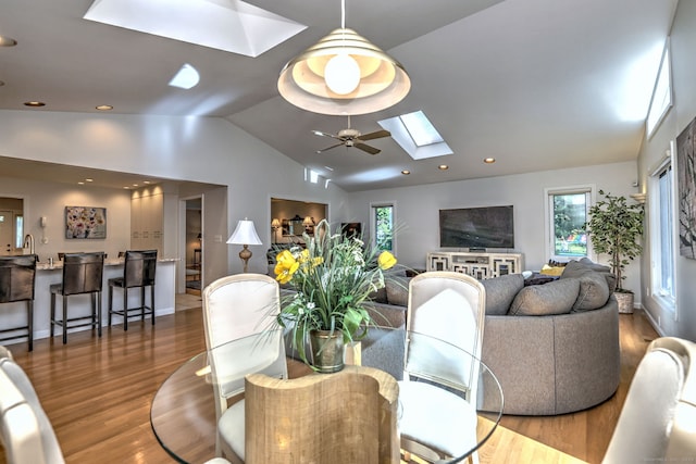 23 Fox Rd, Trumbull, CT 06611 - dining area with a skylight, wood finished floors, vaulted ceiling, ceiling fan, and recessed lighting