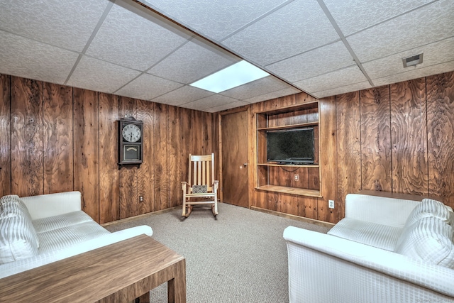 23 Fox Rd, Trumbull, CT 06611 - living area featuring wood walls, a drop ceiling, built in features, and carpet floors