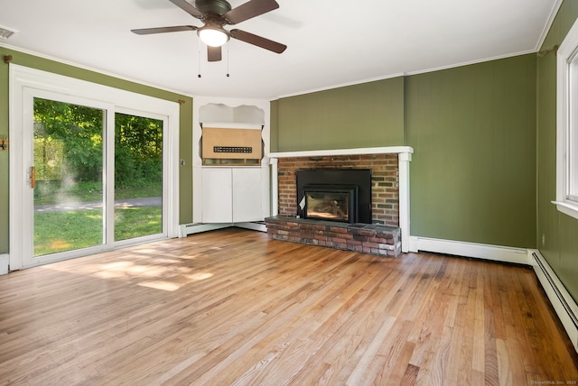 20 Mack Rd, Middlefield, CT 06455 - unfurnished living room featuring a baseboard radiator, hardwood / wood-style flooring, ornamental molding, a ceiling fan, and a brick fireplace