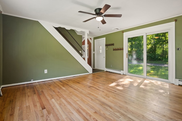 20 Mack Rd, Middlefield, CT 06455 - unfurnished living room featuring baseboard heating, stairs, a ceiling fan, ornamental molding, and wood finished floors