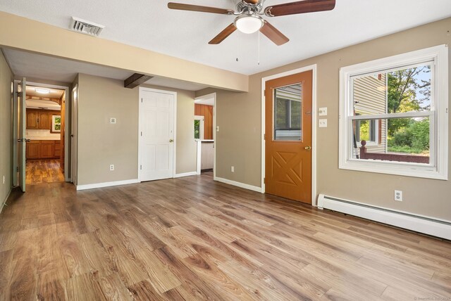 20 Mack Rd, Middlefield, CT 06455 - unfurnished living room featuring wood finished floors, a ceiling fan, and a baseboard heating unit