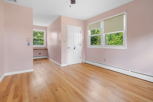 20 Mack Rd, Middlefield, CT 06455 - spare room with baseboard heating, light wood-style floors, ceiling fan, and a baseboard radiator