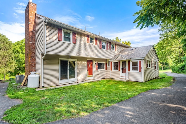 20 Mack Rd, Middlefield, CT 06455 - colonial inspired home with a chimney, entry steps, and a front lawn