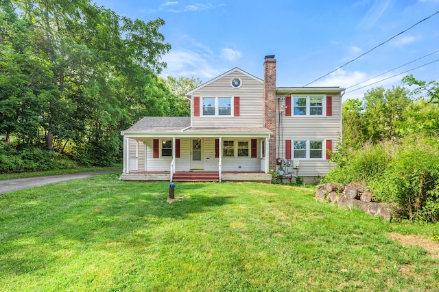 20 Mack Rd, Middlefield, CT 06455 - traditional-style house featuring a chimney, covered porch, and a front yard