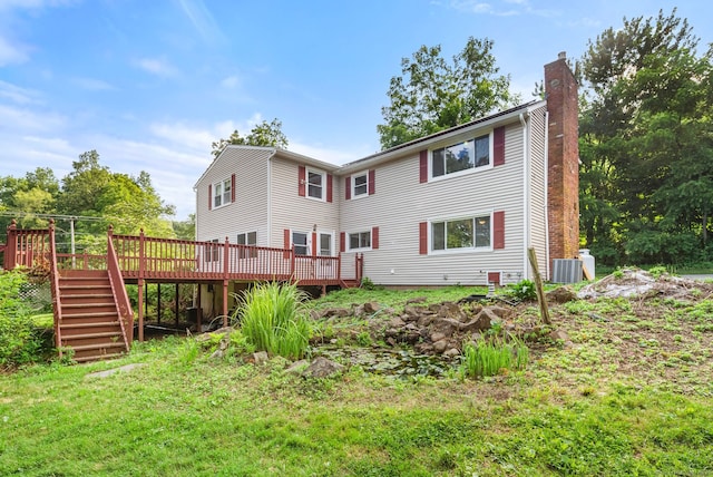 20 Mack Rd, Middlefield, CT 06455 - back of house with a chimney, stairway, and a deck