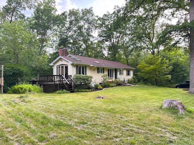 60 Olsen Dr, Mansfield, CT 06250 - back of house with a chimney, a deck, and a yard