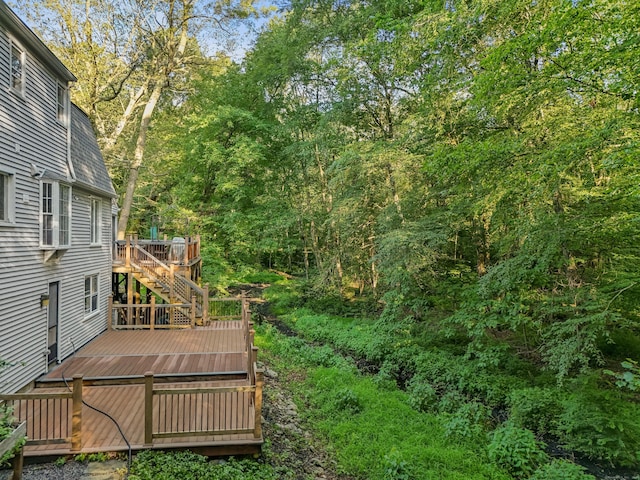 9 Allen Ct, Norwalk, CT 06851 - view of yard featuring a deck, stairs, and a wooded view