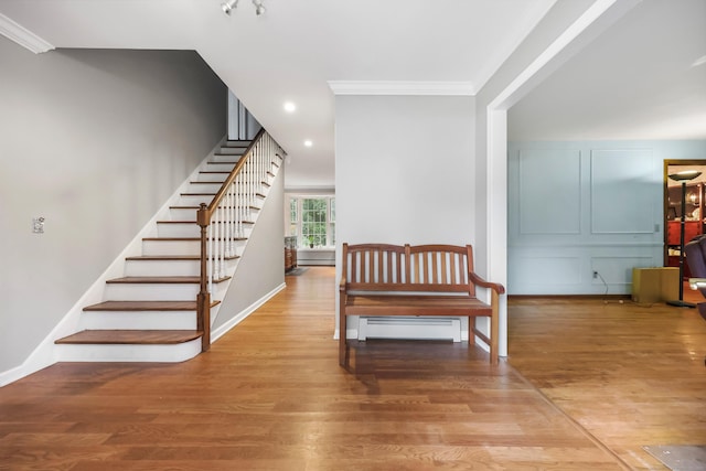 9 Allen Ct, Norwalk, CT 06851 - stairway with crown molding, wood finished floors, and recessed lighting