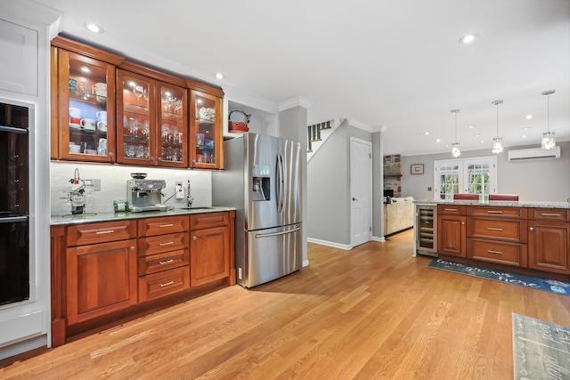 9 Allen Ct, Norwalk, CT 06851 - kitchen featuring stainless steel fridge, wine cooler, light wood-style flooring, recessed lighting, and pendant lighting