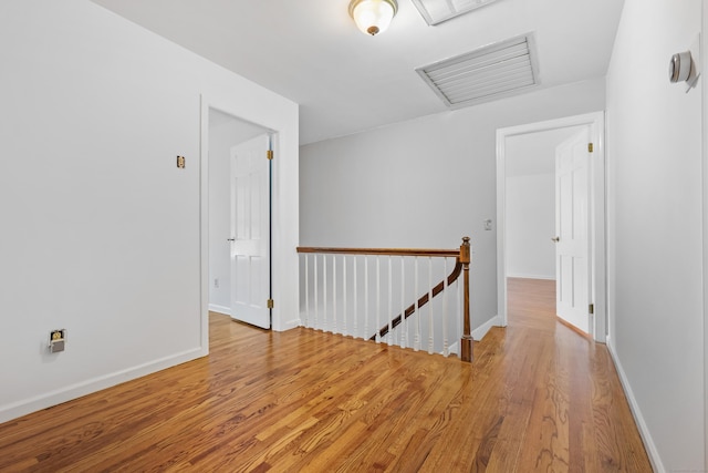 9 Allen Ct, Norwalk, CT 06851 - corridor featuring an upstairs landing, attic access, and wood finished floors