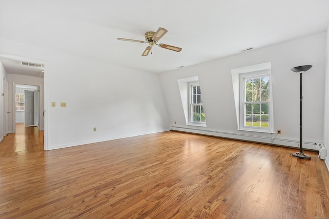 9 Allen Ct, Norwalk, CT 06851 - empty room featuring light wood-type flooring, baseboard heating, and ceiling fan