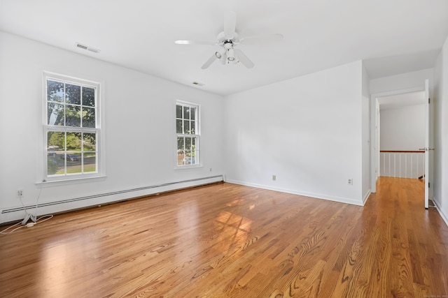 9 Allen Ct, Norwalk, CT 06851 - spare room featuring a baseboard heating unit, wood finished floors, and a ceiling fan