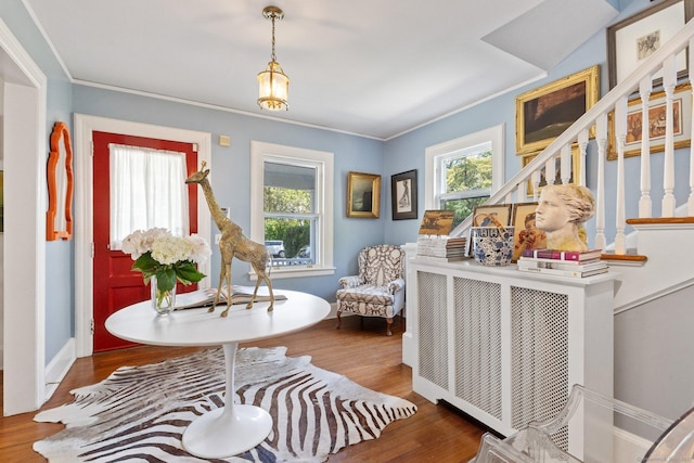 14 Highview Ave, Greenwich, CT 06870 - sitting room with wood finished floors, ornamental molding, and stairway