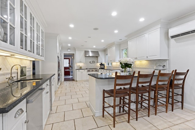 14 Highview Ave, Greenwich, CT 06870 - kitchen with wall chimney exhaust hood, dishwasher, backsplash, a peninsula, and a wall mounted AC