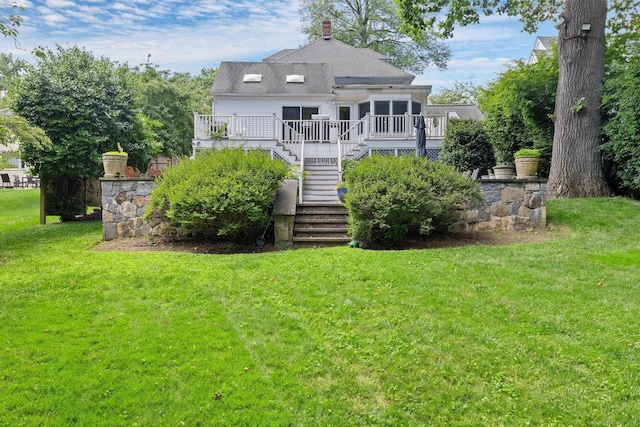 14 Highview Ave, Greenwich, CT 06870 - back of house with stairway, a deck, a yard, and a sunroom