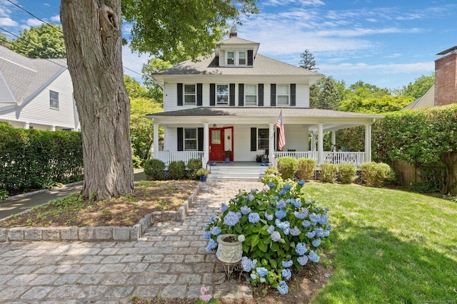 14 Highview Ave, Greenwich, CT 06870 - view of front of property with covered porch, a front lawn, and a chimney