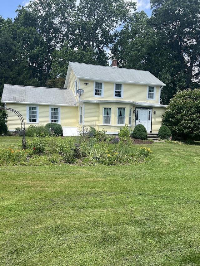 185 Chimney Hill Rd, Wallingford, CT 06492 - view of front of house featuring a front lawn, a chimney, and view of scattered trees