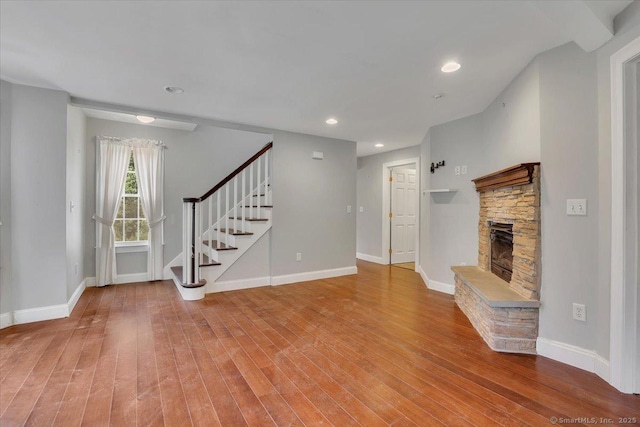 185 Chimney Hill Rd, Wallingford, CT 06492 - unfurnished living room featuring stairs, a fireplace, wood finished floors, and recessed lighting