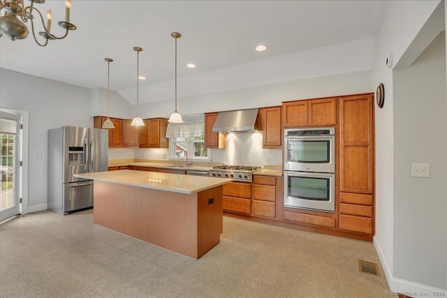 185 Chimney Hill Rd, Wallingford, CT 06492 - kitchen featuring stainless steel appliances, wall chimney exhaust hood, light countertops, brown cabinets, and recessed lighting