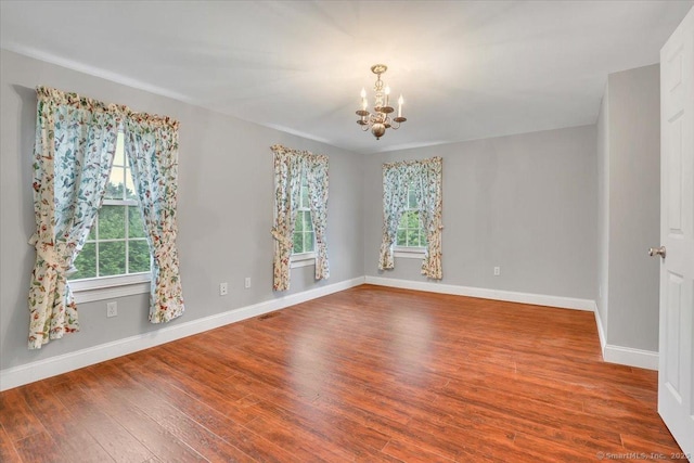 185 Chimney Hill Rd, Wallingford, CT 06492 - spare room with a chandelier, healthy amount of natural light, and wood finished floors