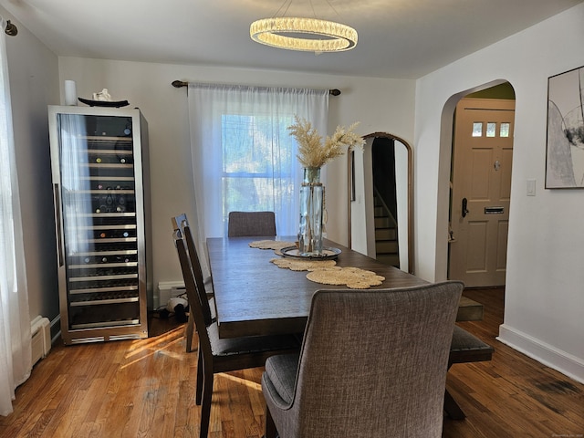 805 Savin Ave, West Haven, CT 06516 - dining area featuring beverage cooler, arched walkways, wood finished floors, and stairs