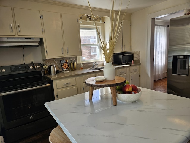 805 Savin Ave, West Haven, CT 06516 - kitchen with appliances with stainless steel finishes, under cabinet range hood, backsplash, and dark wood-type flooring