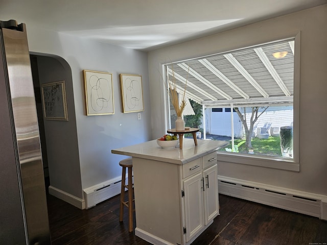 805 Savin Ave, West Haven, CT 06516 - kitchen with baseboard heating, dark wood-type flooring, and white cabinets