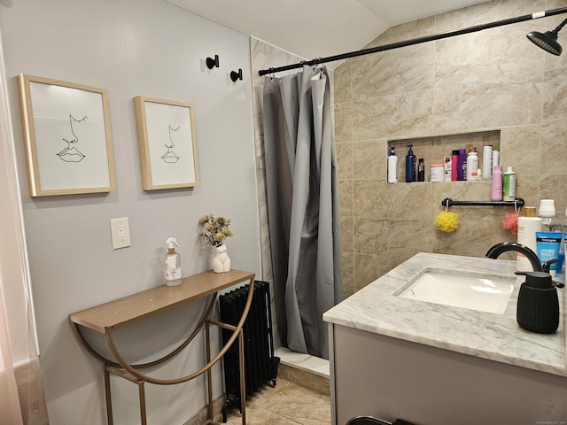 805 Savin Ave, West Haven, CT 06516 - full bath featuring vanity, curtained shower, radiator, tile walls, and vaulted ceiling