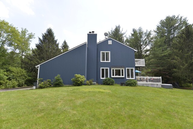 33 Oneil Rd, Oxford, CT 06478 - view of property exterior featuring a lawn, a deck, and a chimney