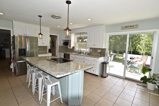 33 Oneil Rd, Oxford, CT 06478 - kitchen with stainless steel appliances, tasteful backsplash, white cabinets, a kitchen breakfast bar, and decorative light fixtures