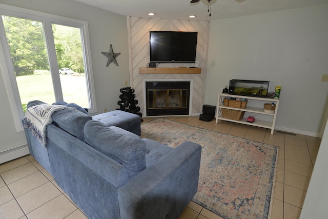 33 Oneil Rd, Oxford, CT 06478 - tiled living room featuring healthy amount of natural light, a fireplace, a ceiling fan, recessed lighting, and a baseboard heating unit