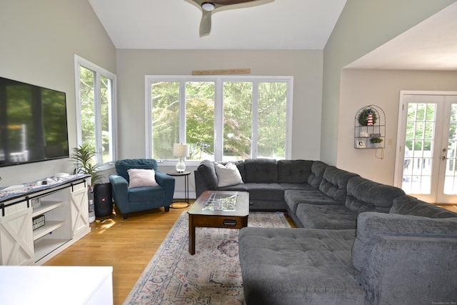 33 Oneil Rd, Oxford, CT 06478 - living area featuring vaulted ceiling, plenty of natural light, light wood finished floors, and a ceiling fan