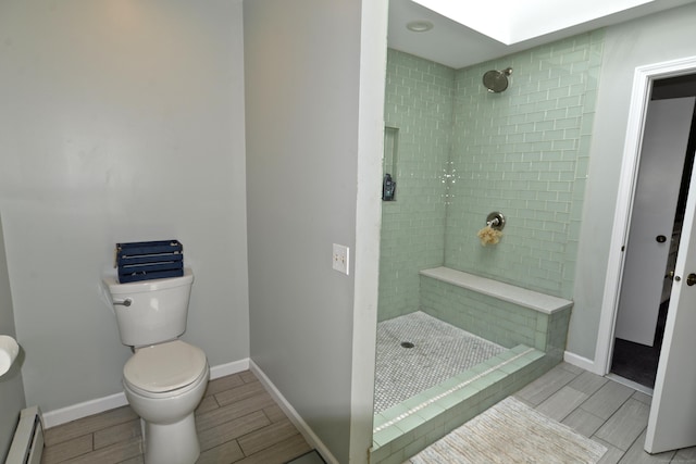 33 Oneil Rd, Oxford, CT 06478 - full bathroom featuring a baseboard radiator, wood finish floors, and a stall shower