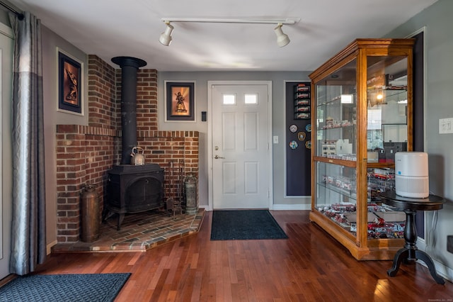 33 Thorpe St, North Haven, CT 06473 - foyer entrance featuring a wood stove and hardwood / wood-style floors