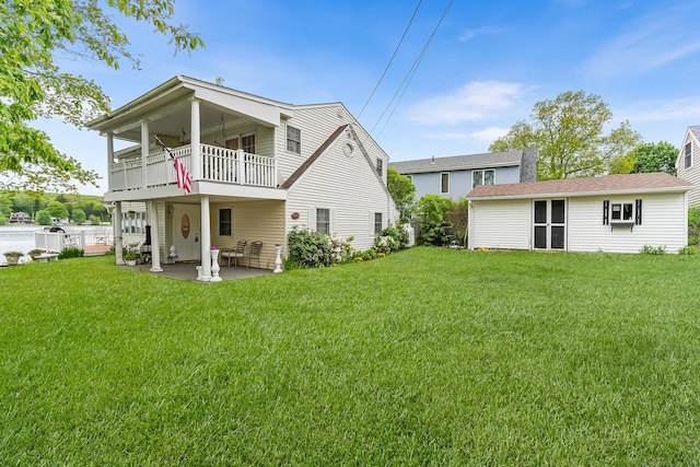 11 Bayside Dr, Wales, MA 01081 - back of house with a balcony, a yard, and a patio