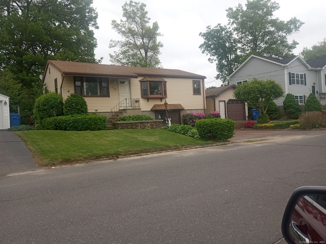 260 Capitol Ave, Waterbury, CT 06705 - view of front facade featuring an outbuilding and a front yard