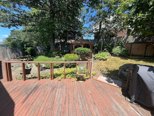 260 Capitol Ave, Waterbury, CT 06705 - wooden deck featuring a gazebo, a fenced backyard, a storage shed, and area for grilling