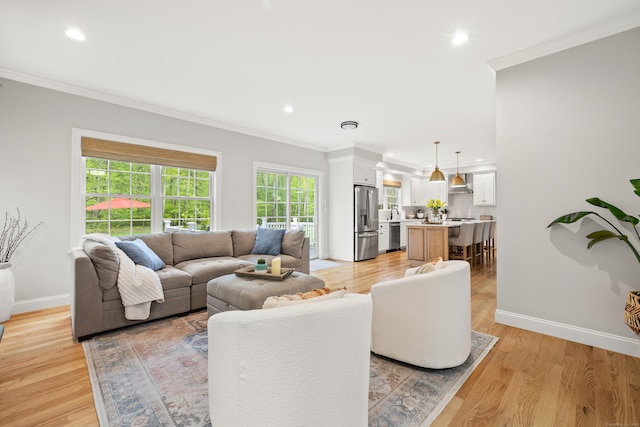 261 W St, Hebron, CT 06248 - living area with recessed lighting, crown molding, and light wood-style flooring